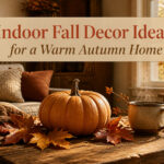 A cozy indoor fall decor setup with pumpkins and warm textiles.